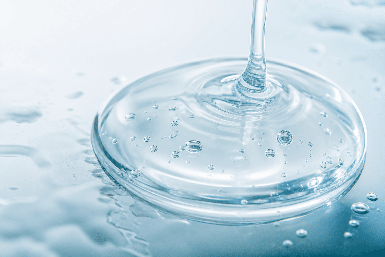 Macro close-up of a clear hyaluronic acid serum texture
