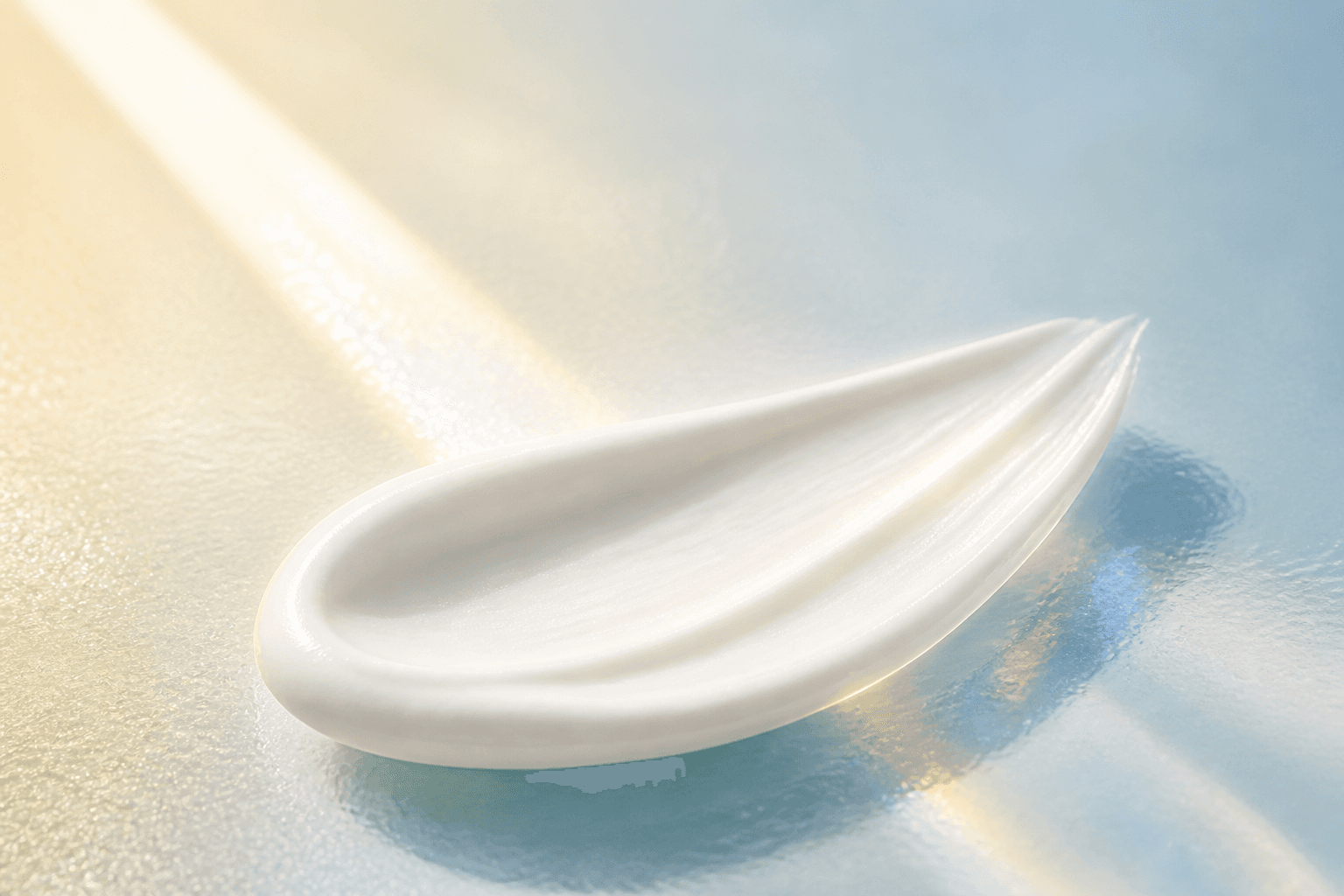 Macro close-up of white sunscreen texture in daylight